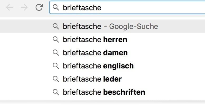 Abbildung der Google Suggest mit dem Beispiel Brieftasche für die Keyword-Recherche im Rahmen der Amazon SEO